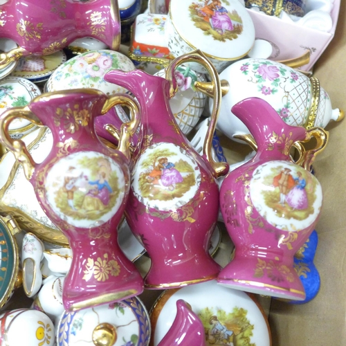 702 - A collection of decorative china, trinket boxes and vases, including del Prado and Limoges