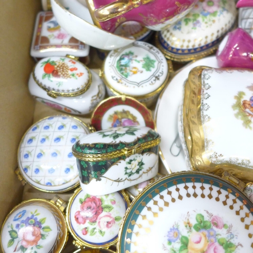 702 - A collection of decorative china, trinket boxes and vases, including del Prado and Limoges