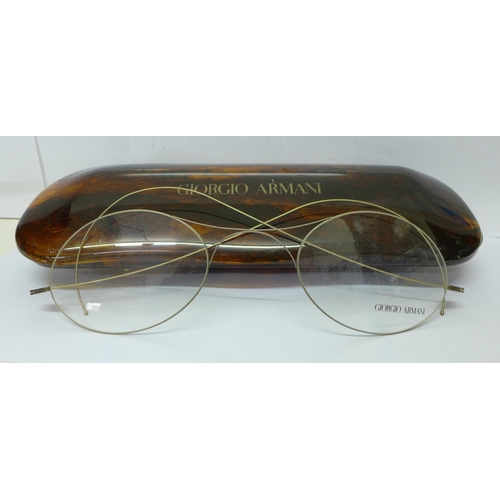 714 - A pair of large Giorgio Armani shop advertising spectacles, with signed case