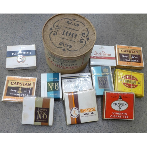 720 - An unopened box of 100 Wills Courts cigars and a collection of unopened cigarettes including Wills H... 