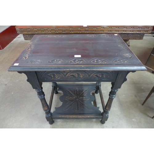 100 - A Victorian carved oak occasional table