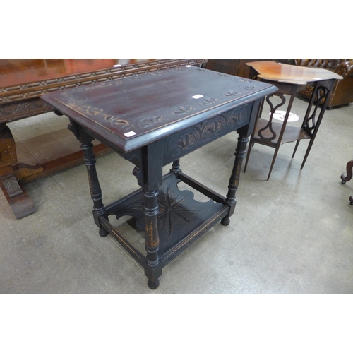 100 - A Victorian carved oak occasional table