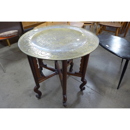 102 - A Chinese brass topped folding occasional table