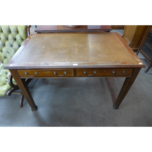 105 - A Victorian mahogany two drawer library table