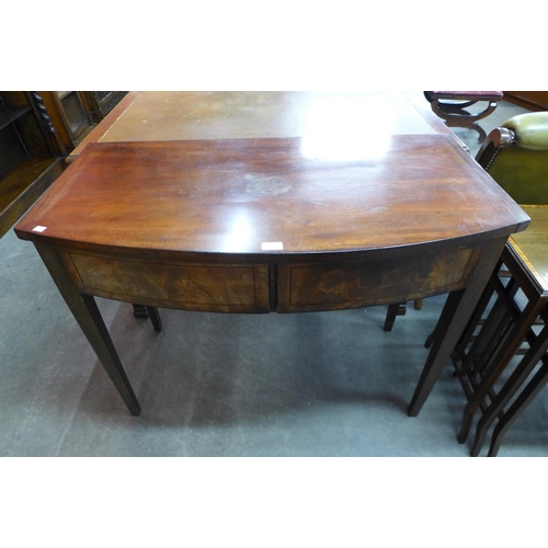 106 - A George III mahogany bow front two drawer side table