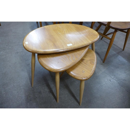 130 - An Ercol Blonde pebble shaped nest of tables