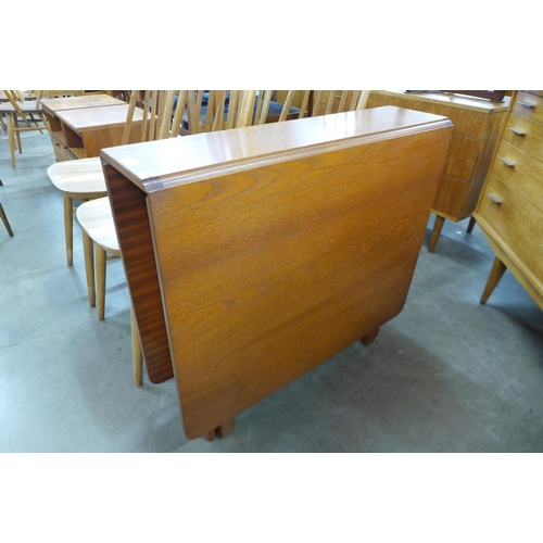 138 - A teak drop-leaf table