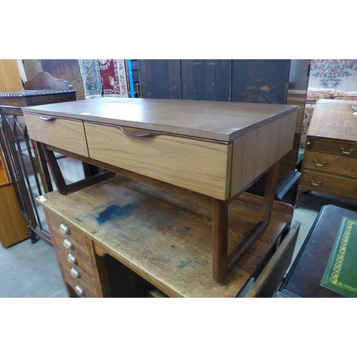 150 - A teak two drawer coffee table