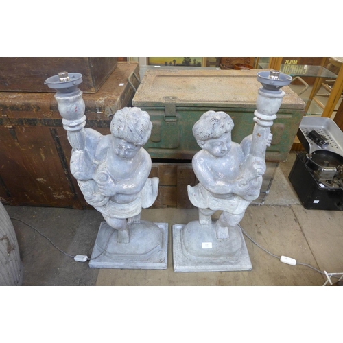 308 - A pair of painted wood cherub table lamps