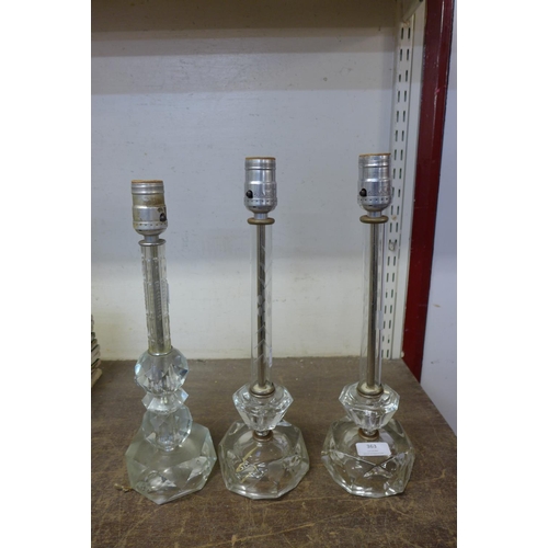 363 - A pair of cut glass table lamps and one other