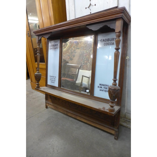 67 - A Victorian beech overmantel mirror, bearing Cadburys Chocolate inscription