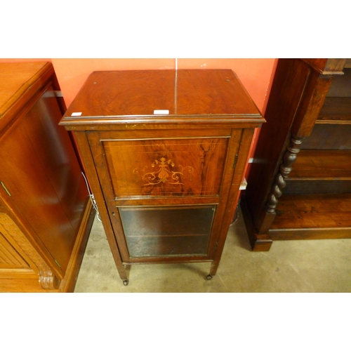 77 - A Victorian inlaid mahogany music cabinet