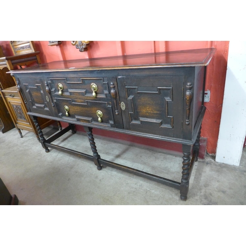 89 - An oak geometric moulded barleytwist dresser