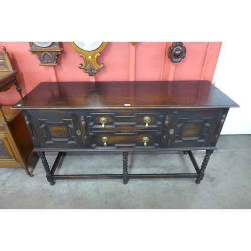 89 - An oak geometric moulded barleytwist dresser