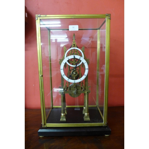 92 - A brass skeleton clock, cased