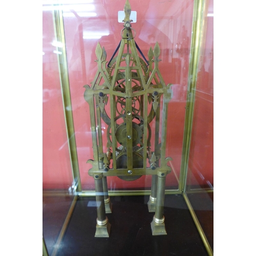 92 - A brass skeleton clock, cased