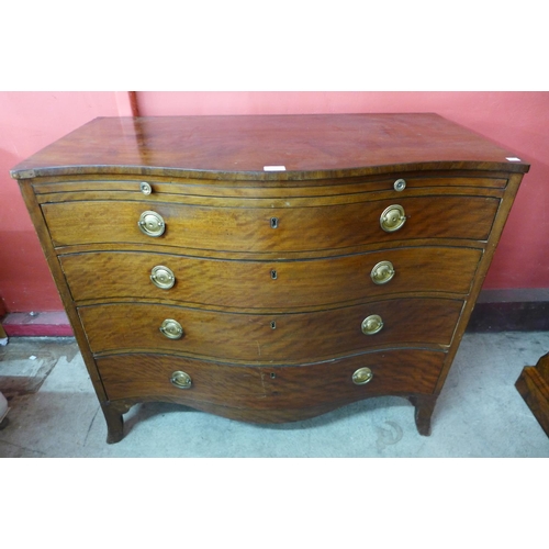 94 - A George III mahogany serpentine chest of drawers, drawer stamped H. Mawer & Stephenson, London