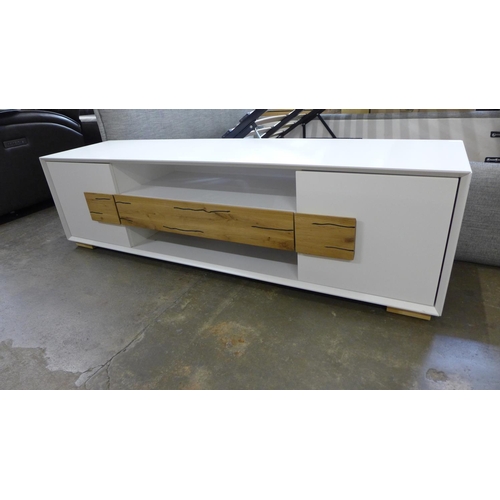 1506 - A two door, one drawer white Orion TV unit - boxed