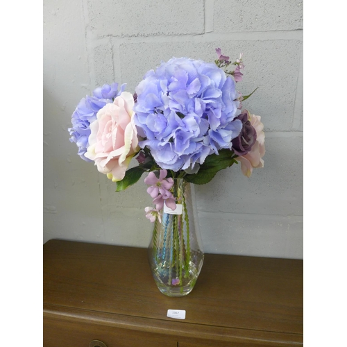 1368 - Tall rainbow glass vase with silk blue hydrangea, pink garden roses, set in acrylic solid water