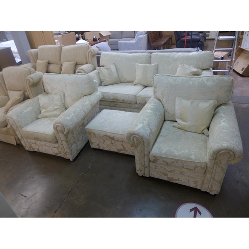 1542 - A cream upholstered four piece suite, ottoman pouffe