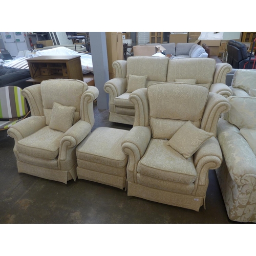 1546 - A cream upholstered sprung edge four piece suite