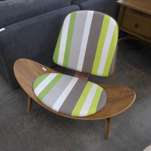 1553 - A Hans Wegner style shell chair with green and white striped seats