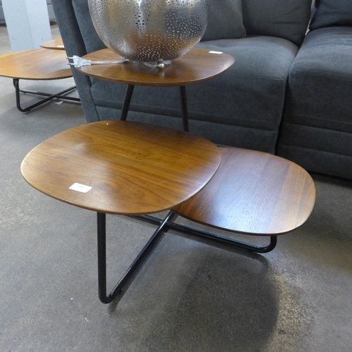 1561 - A walnut three top black base coffee table