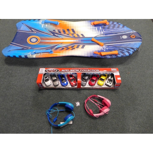 3150 - Two Pairs Of Kid'S Motorola Headphones, A Pack Of Eight Auto Show Cars, A 50