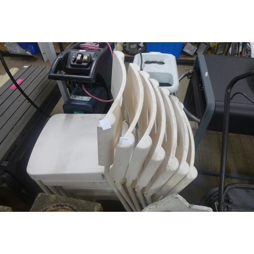 2380 - 7 Stacking white plastic garden chairs *This lot is subject to vat