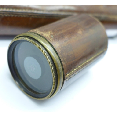 696 - A WWI period brass and leather telescope