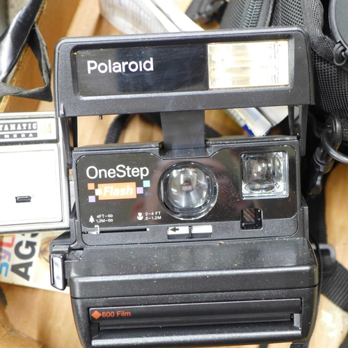 718 - A box of Polaroid and other cameras, etc.