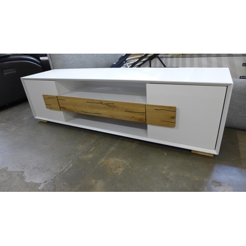 1506 - A two door, one drawer white Orion TV unit - boxed