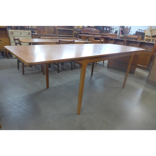 97 - A McIntosh teak double extending dining table