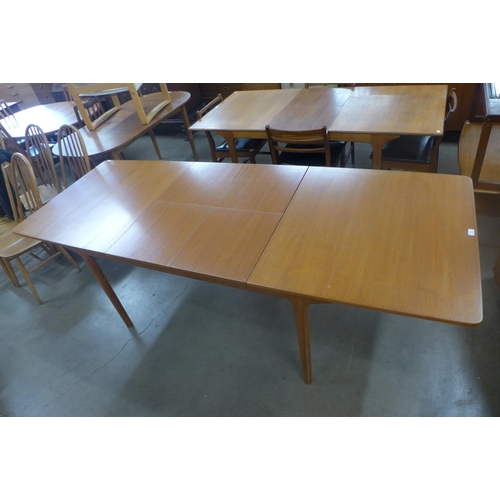 97 - A McIntosh teak double extending dining table