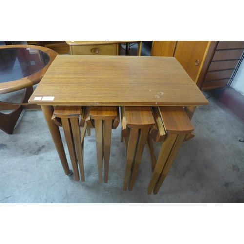 111 - A teak nest of tables