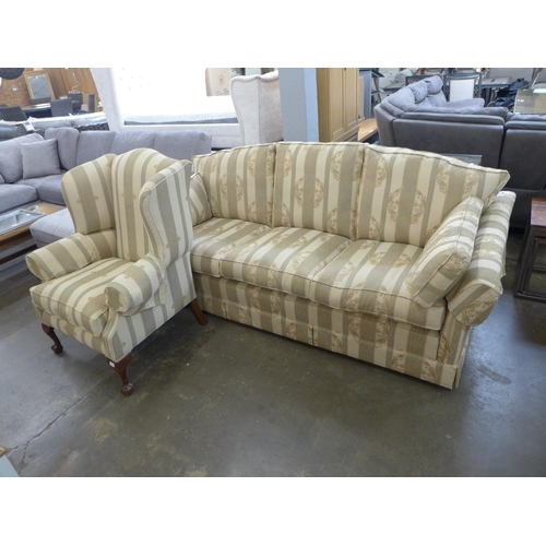 1559 - A cream striped upholstered three seater sofa with armchair