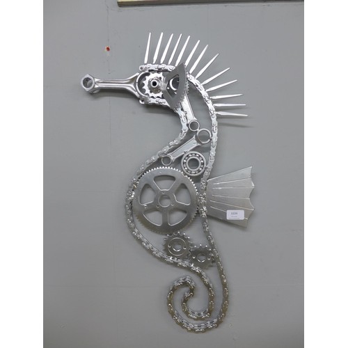 1634 - Upcycled art; a metalwork seahorse, made with motorbike parts.