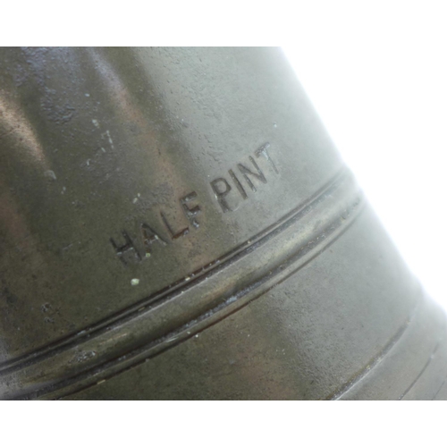 603 - A set of three pewter and copper graduated mugs, Quart, Pint and Half-Pint, marked GR