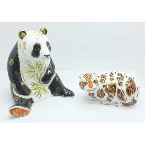 651 - Two Royal Crown Derby paperweights, Giant Panda and New Year Tiger, both with gold stoppers, boxed