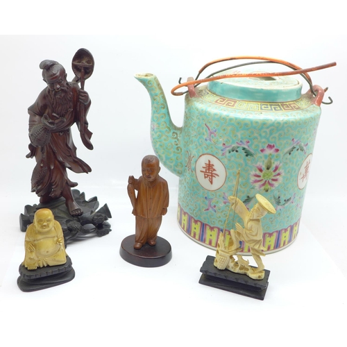653 - A Chinese teapot, an oriental carved fisherman and boy and two other carved figures, (5)