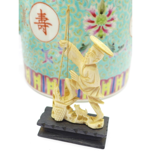 653 - A Chinese teapot, an oriental carved fisherman and boy and two other carved figures, (5)