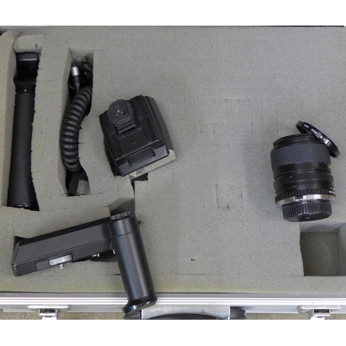 784 - Olympus OM40 35mm film cameras x2, four lenses, (Sigma mini-wide II 1:2.8, Olympus Auto-S 50mm 1:1.8... 