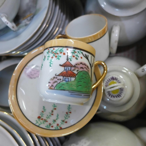 791 - A Japanese eggshell tea set and one other part Japanese tea set