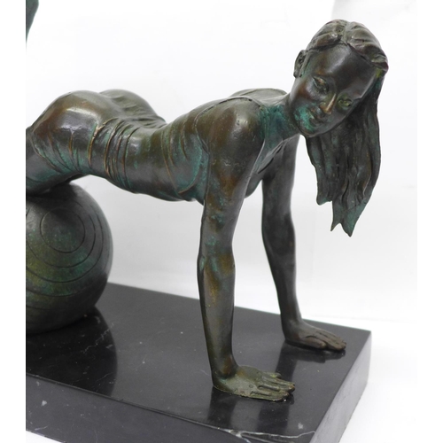 808 - A bronze figure of a girl exercising on a black onyx plinth