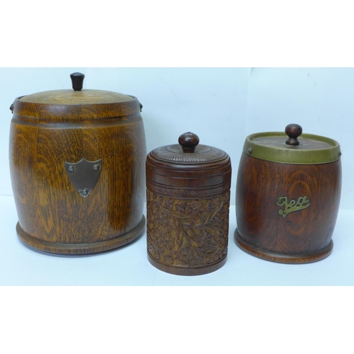 811 - Two wooden tobacco jars and a wooden tea caddy