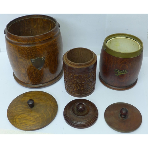811 - Two wooden tobacco jars and a wooden tea caddy
