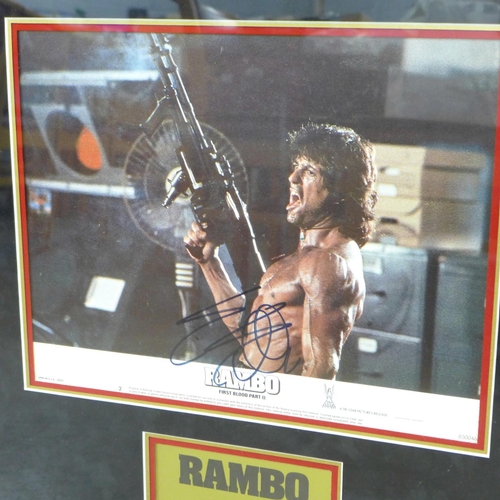 819 - Two Sylvester Stallone mounted and framed photographs with signatures, Rocky and Rambo, First Blood ... 