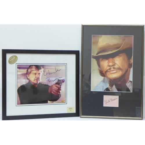 823 - A signed Charles Bronson mounted and framed photograph with a certificate of authenticity on reverse... 