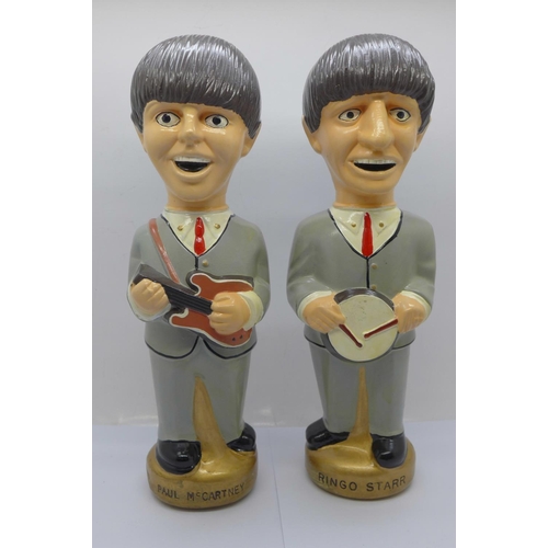 827 - The Beatles pot figures, Paul McCartney and Ringo Starr, stamped NEMS 1965 to the base, Paul McCartn... 
