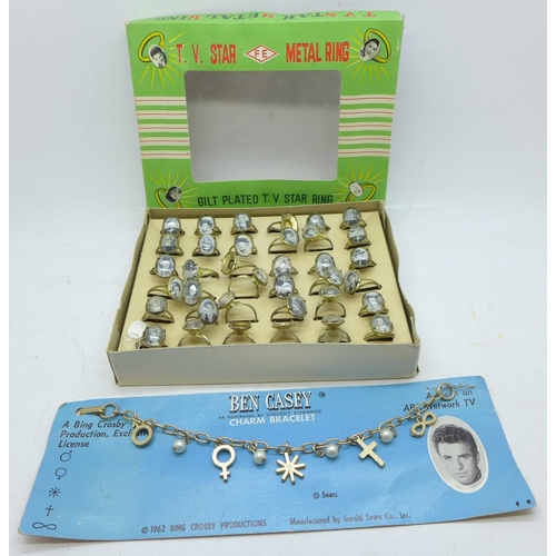 838 - American interest; box of TV star metal rings and a Ben Casey charm bracelet 1962